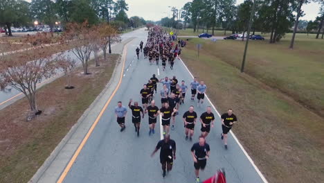 Aerial-Over-Us-Army-Recruits-Jogging-Down-A-Road-During-Basic-Training