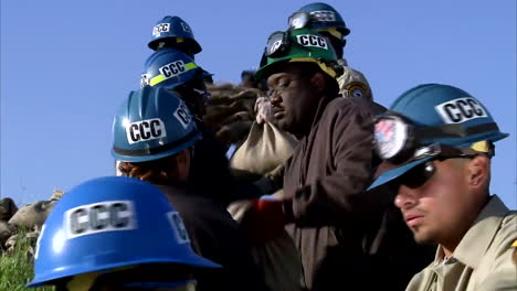 Members-Of-The-California-Conservation-Corps-Pass-Sandbags-During-A-Major-Flooding-Event