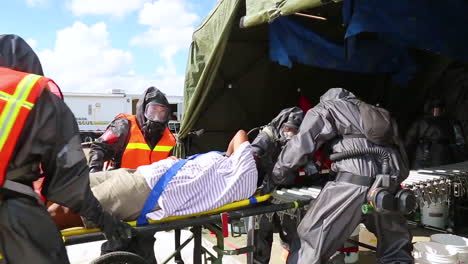 Volunteers-With-Simulated-Wounds-Are-Treated-By-Miamidade-Fire-Fighters-And-Us-Soldiers-In-A-Joint-Training-Exercise