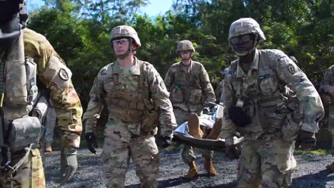 Us-Marines-Carry-A-Wounded-Man-To-A-Uh60-Black-Hawk-Medical-Helicopter-As-Part-Of-A-Training-Exercise