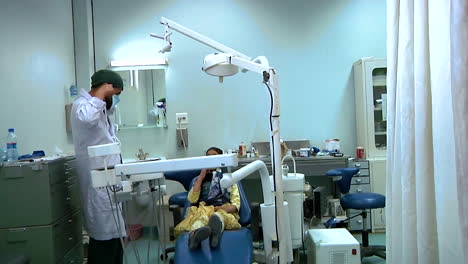 A-Little-Girl-Gets-Her-Teeth-Inspected-At-The-Afghanistan-Regional-Military-Hospital