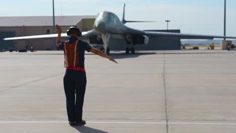 An-Aircraft-Marshal-Directs-A-Usaf-Plane-On-An-Air-Force-Base