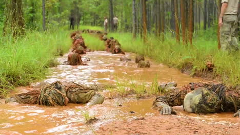 Soldiers-At-Fort-Bennings-Sniper-School-Wade-Through-Muddy-Waters-In-Their-Ghillie-Suits