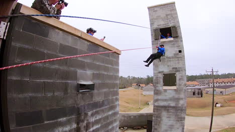 Members-Of-The-Mississippi-Task-Force-Search-And-Rescue-Team-Simulate-Being-Rescued-From-A-Collapsed-Structure