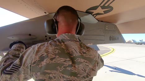 A-Man-Inspects-A-Military-Jet-At-Nellis-Air-Force-Base-Prior-To-the-Red-Flag-191-Exercise-2019