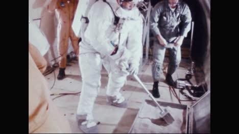 Astronaut-Neil-Armstrong-Practices-Collecting-Dirt-Samples-While-In-Training-1969