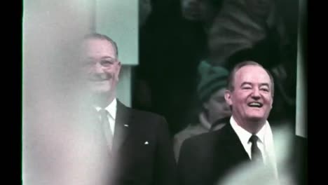 Lyndon-B-Johnson-Watches-From-the-Presidental-Suite-As-His-Inaugural-Parade-Passes-Washington-Dc-1965