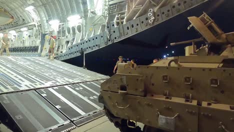 Us-Army-Task-Force-Spartan-Shield-Soldiers-Load-M2-Bradley-Fighting-Vehicles-Onto-A-Cargo-Plane-For-Syria