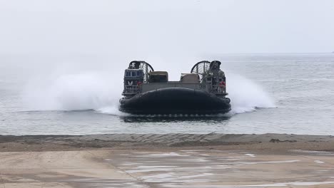 Us-Marine-Air-Cushioned-Landing-Craft-Tranports-Weapons-From-Ship-To-Shore-During-A-Field-Exercise-California