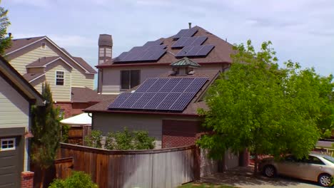 Aerial-Of-Solar-Panels-Adorning-The-Tops-Of-Houses-In-A-Residential-Neighborhood