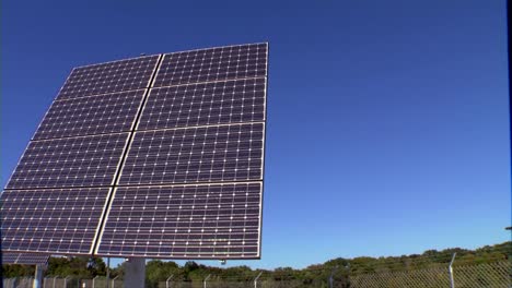 A-Solar-Panel-Array-Is-Used-To-Power-A-Television-Transmitter-And-Tower