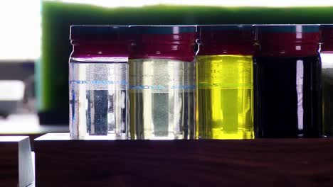Samples-Of-Biofuel-Derived-From-Algae-Sit-On-A-Shelf