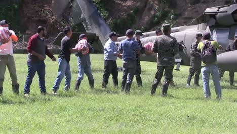 Us-Army-And-Honduran-Soldiers-And-Volunteers-Unload-Humanitarian-Aid-From-A-Uh60-Black-Hawk-Helicopter