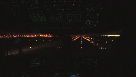 Point-Of-View-Cockpit-Perspective-Of-A-Commercial-Airplane-Taking-Off-At-Night