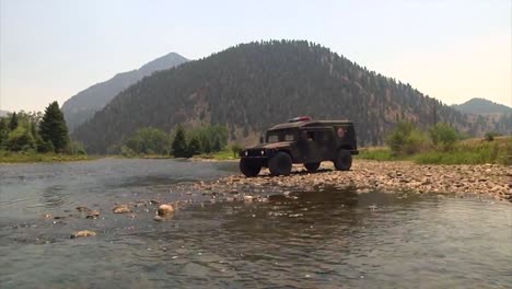 An-Emergency-Vehicle-Crosses-A-River-In-Colorado