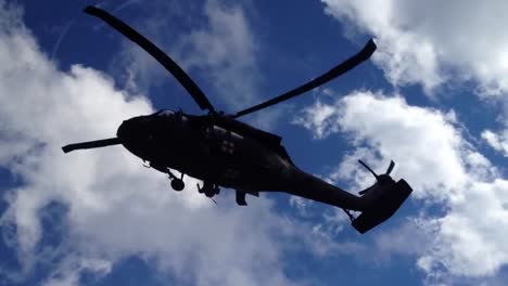 An-Emergency-Rescuer-Rappels-From-A-Helicopter-During-A-Rescue