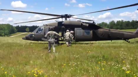 Us-Army-Troops-Load-Into-A-Blackhawk-Helicopters-And-Fly-Off-On-A-Mission