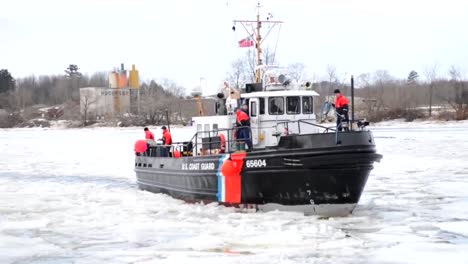 A-Coast-Guard-Cutter-Boat-Breaks-Ice-On-The-Penobscot-River-In-Maine