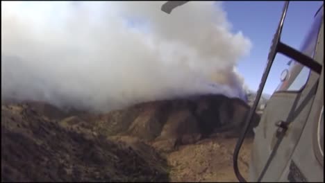 Pov-Shot-Of-A-Helicopter-Makes-Water-Drops-On-A-Forest-Fire-1