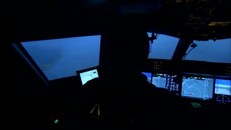 Interior-Of-An-Airplane-Cockpit-As-Pilots-Taxi-On-A-Runway-In-A-Storm