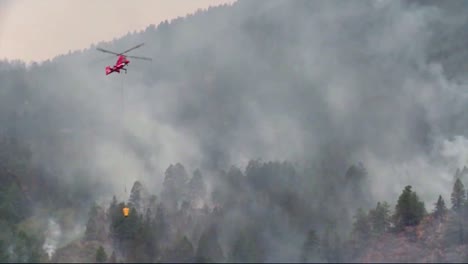 A-Helicopter-Makes-Water-Drops-On-A-Forest-Fire-2