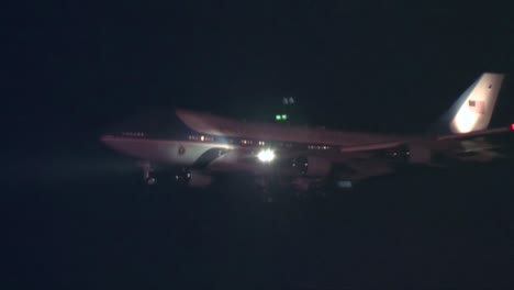 Air-Force-One-Lands-And-Taxis-On-The-Runway-At-Night