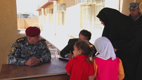 Us-Soldiers-Hand-Out-Water-Filters-Toys-And-School-Supplies-To-People-In-Baghdad-Iraq-1