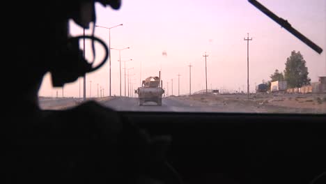 Pov-Shot-From-An-Armored-Humvee-Of-Us-Soldiers-In-A-Convoy-On-A-Highway-In-Iraq