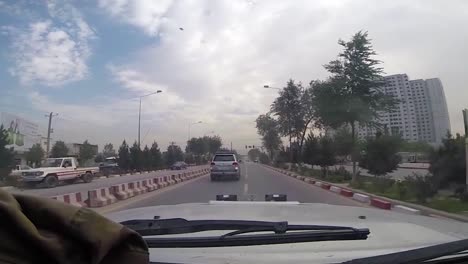 Pov-Shots-Of-Soldiers-Driving-A-Car-In-And-Around-Kabul-Afghanistan
