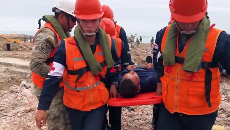 Peruvian-Army-Search-And-Rescue-Specialists-Work-On-Injured-Survivors-Of-A-Mock-Disaster-On-A-Beach-In-Lima-Peru