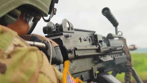 A-Us-Soldier-Fires-A-Machine-Gun-In-Battle-On-The-Battlefield