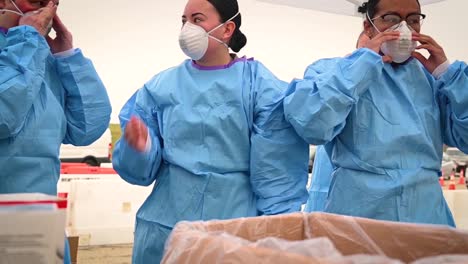 Covid19-Coronavirus-Patients-Are-Tested-At-A-Drive-Thru-Clinic-Gowns-Masks-And-Hand-Sanitizer-Shown