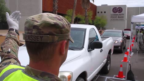 During-The-Covid19-Coronavirus-Epidemic-Outbreak-Members-Of-The-Armed-Forces-Hand-Out-Groceries-At-A-Food-Bank-In-Arizona-2