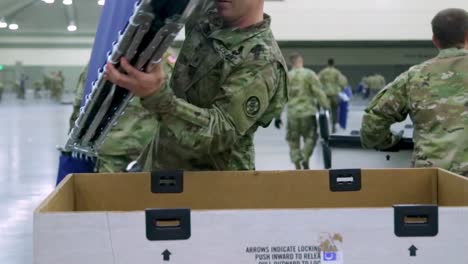 Maryland-National-Guardsmen-Set-Up-Beds-And-Cots-At-An-Emergency-Hospital-During-The-Coronavirus-Covid19-Outbreak-Epidemic