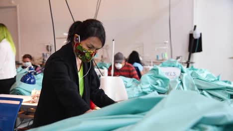 Private-Companies-Start-To-Make-Gowns-And-Masks-In-Small-Factories-During-The-Coronavirus-Covid19-Pandemic-Outbreak-2