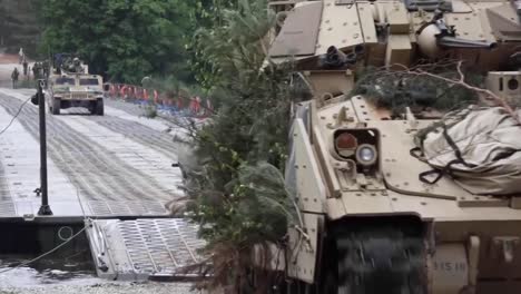 Us-And-Polish-Soldiers-Cross-A-Río-In-Humvees-And-Bradley-Fighting-Vehicles-At-Drawsko-Pomorskie-Poland-2