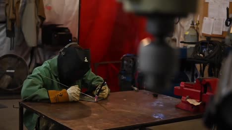 Slow-Motion-Of-Us-Air-Force-Airmen-Of-the-332-Aew-Use-An-Arc-Welder-In-their-Maintenance-Duties