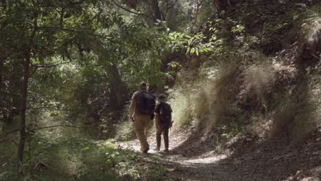 A-father-and-son-bond-their-friendship-and-relationship-while-walking-on-a-wilderness-trail-Gaviota-Coast-California-2