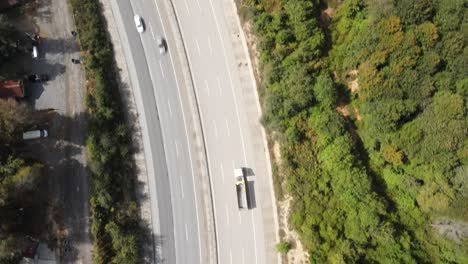 Aerial-View-Of-The-Two-Sides-Of-A-Highway-Surrounded