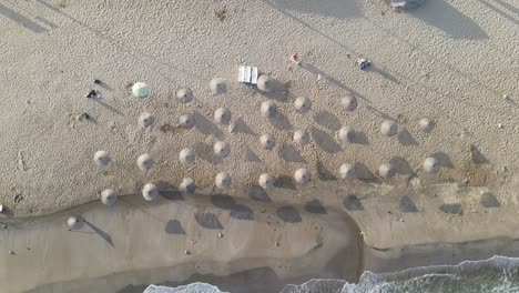 Umbrellas-In-Empty-Sand-Beach