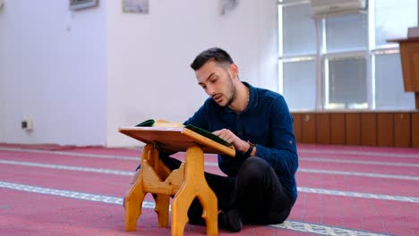 Man-Reading-Quran-In-Mosque-2