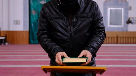 Old-Maksed-Man-Reads-The-Quran-In-Mosque
