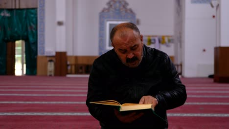 Middle-Age-Man-Reads-Quran-In-Mosque-2