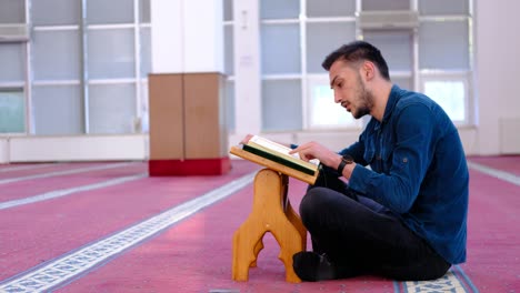 Young-Muslim-Man-Reciting-The-Quran-In-Mosque