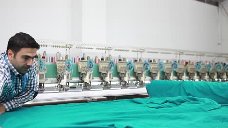 Tailor-Cutting-Fabric-For-Sewing