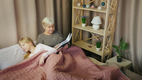 An-elderly-woman-reads-a-fairy-tale-to-a-child-1