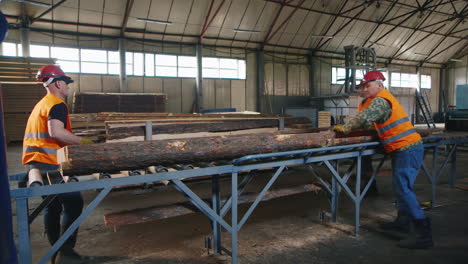 A-group-of-workers-works-at-a-sawmill