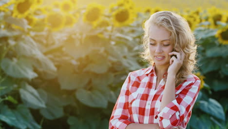A-successful-young-farmer-is-on-the-phone-in-a-corn-field-2
