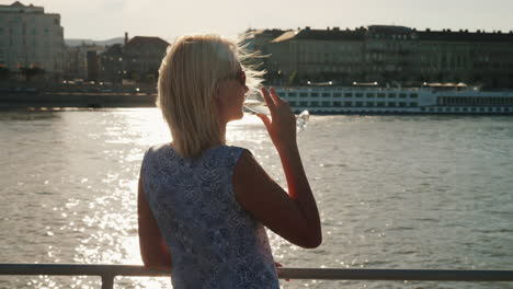 A-Woman-With-A-Glass-Of-Champagne-Sails-On-The-Boat