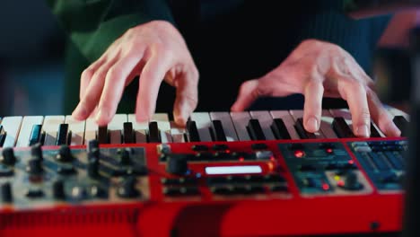 Fingers-of-a-musician-plays-an-electronic-piano